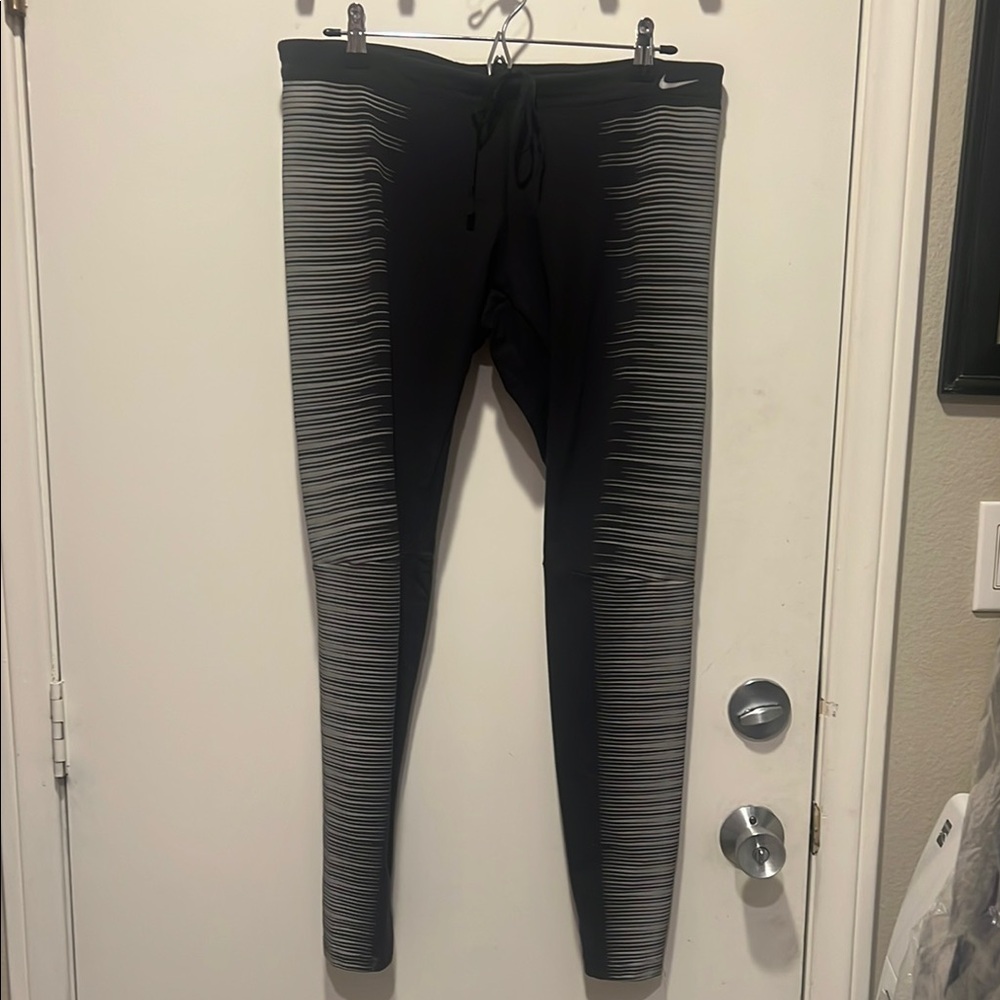 Nike womens Black and Gray Leggings that glow in the dark. Worn maybe 2 times
